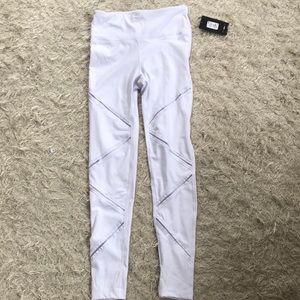 White leggings with cross cross on front